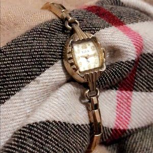 Authentic Elgin 14k gold faced vintage watch....